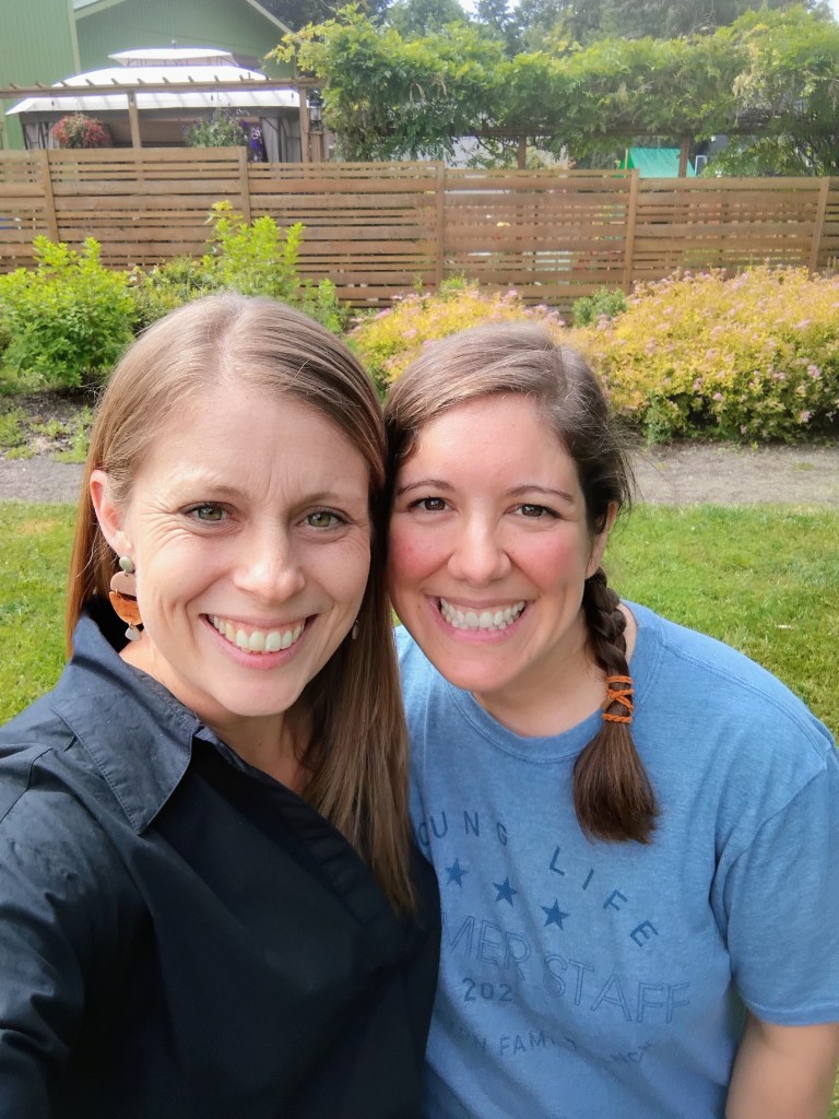 Jill and Jenny, director of YoungLives, smiling together outdoors